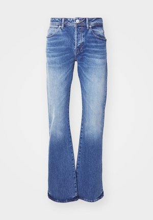 Lys blå denim flared jeans med en falmet vask, fem lommer, knappestengning og sydd detaljer langs sømmene. Bred benåpning.