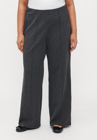 Gray wide-leg trousers with a soft texture, featuring a high waist and subtle front seam details, paired with black flat shoes.