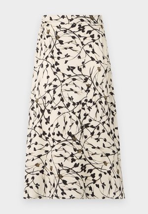 A beige skirt with a black floral pattern and thin branches. The design features small leaves and occasional golden accents.