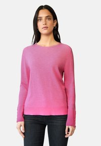 Pull en maille rose à manches longues avec un col rond, un ourlet côtelé et des boutons décoratifs aux poignets. Texture douce, coupe décontractée.