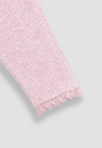 Pink ribbed fabric sleeve with a scalloped, openwork trim at the cuff. Soft texture with a subtle heathered pattern.