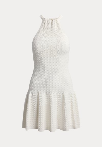 Sleeveless white knit dress with cable patterns, halter neckline, fitted bodice, and flared skirt.
