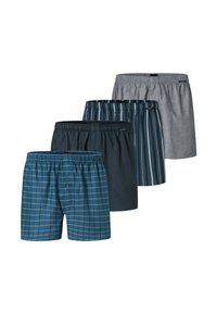 Quattro paia di boxer: uno in pattern a griglia blu, due in colori scuri e uno grigio a righe; tutti presentano fasce elastiche in vita.