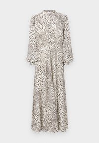 Hosszú, gombos ruha áttetsző anyagból, krémszínű alapon barna pöttyökkel. Magas nyakkal és bő ujjakkal rendelkezik, amelyek a szegélyig folynak.