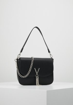 Black leather shoulder bag with silver chain strap and "V" logo clasp featuring silver tassel, displayed on a white pedestal against a plain background.