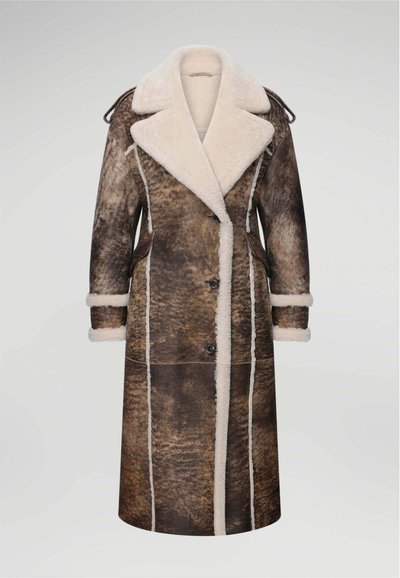 Long brown shearling coat with a wide collar, button closure, and plush white lining. Features two front pockets and contrasting seams.