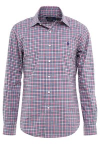 Herrskjorta med lång ärm i en flerfärgad rutmönster i blått, grönt och rosa. Har krage med knappar och logotyp på bröstet. Tillverkad av bomull.
