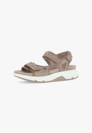 Beige suede open-toe sandal with adjustable Velcro straps and cushioned white sole for comfort and support.