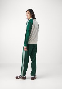 adidas Originals ARCHIVE - Träningsbyxor - collegiate green