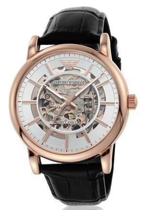 Mechanical watch with a rose gold stainless steel case, white dial, black crocodile leather strap, and exposed movement detail.