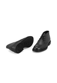 Schwarze Leder-Ankle-Boots mit glatter Textur, runder Zehenpartie, Schnürdesign und Gummisohlen mit kreisförmigen Profilen.