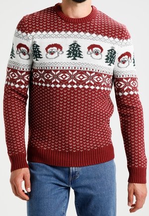 Red knit sweater featuring white Christmas designs with Santa faces and trees, ribbed cuffs and hem, with a textured pattern throughout.