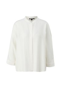 Blouse blanche à manches longues avec col bande et boutons dissimulés sur le devant, conçue pour une coupe ample et confortable.