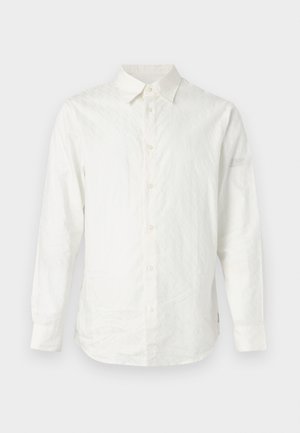 Camicia bianca a maniche lunghe in tessuto texture, con chiusura a bottoni frontale e colletto a punta. Motivo sottile sulla parte anteriore superiore.