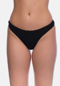 Schwarzer Baumwoll-Thong mit weichem Bündchen, das ein kleines zentrales Schleifchen-Detail aufweist, glatte Textur und minimalistisches Design.