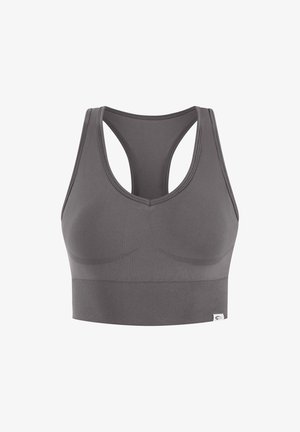 Brassière de sport grise sans couture avec un design dos nageur, larges bretelles et bande côtelée pour le maintien, présentée sur fond blanc.