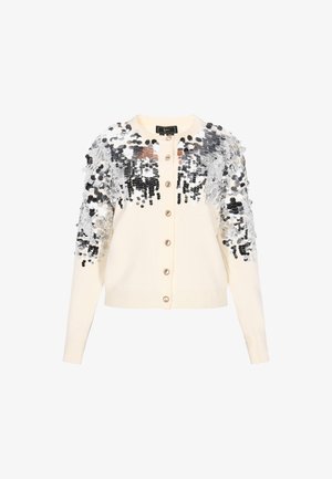 Cardigan crem cu paiete argintii pe umeri, închidere cu buton, manșete și tiv cu dantelă, și o textură netedă pe tot parcursul.