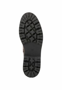 Semelle en caoutchouc noir avec des motifs de rainures profonds, y compris des formes croisées et des crêtes, taille marquée 37. Finition texturée pour une meilleure adhérence.