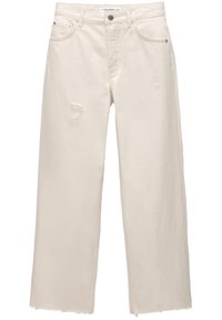 Jeans de pierna ancha en color blanco roto, fabricados con denim de algodón. Cuentan con detalles de desgastes y un dobladillo deshilachado. Diseño clásico de cinco bolsillos con detalles metálicos.