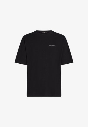 Musta puuvillapaita, jossa on pyöreä kaula-aukko ja lyhyet hihat; edessä pieni valkoinen logo-tarra, jossa lukee "KARL LAGERFELD." Yksinkertainen muotoilu.