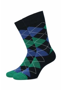 Czarne skarpetki z geometrycznym wzorem w romby w niebieskim i zielonym kolorze, z zielonym palcem i białymi akcentami na szwach.