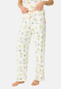 Vita pyjamasbyxor med ett tryckt mönster av cocktails, limer och växter. Tillverkade av mjuk tyg, med elastisk midja och snörning.