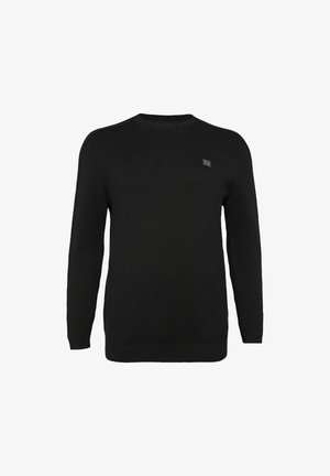 Zwarte trui van een zachte brei-stof, met een ronde hals, lange mouwen en een klein logo op de borst.