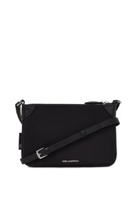 Borsa a tracolla nera in nylon, caratterizzata da una texture liscia, dettagli in metallo argentato e tracolla in pelle regolabile. Logo visibile sulla parte anteriore.