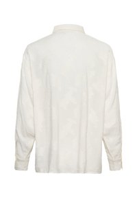 Chemise blanche à manches longues avec un motif jacquard floral subtil, col classique et poignets boutonnés, vue de dos sur fond blanc.
