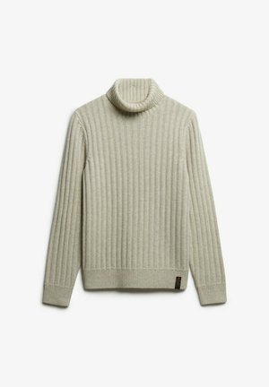 Beige ribbed turtleneck sweater lavet af strikket materiale. Den har en høj, rullet krave og et lille logo mærke på den nederste side.