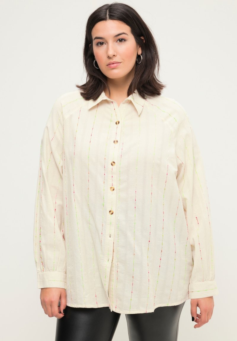 Camicia button-up beige chiaro con righe verticali multicolori, maniche lunghe e vestibilità comoda. Realizzata in un tessuto testurizzato.