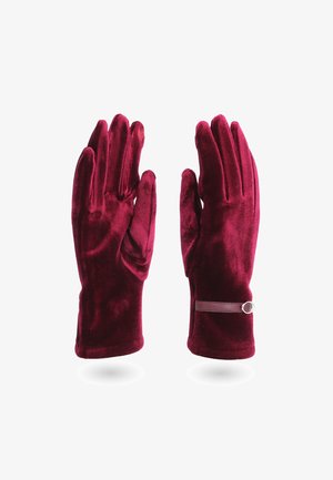 Guanti in velluto bordeaux con una texture liscia, design aderente e un cinturino sottile con un dettaglio circolare.
