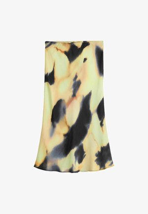 Jupe midi tie-dye jaune et noire avec un ourlet légèrement évasé, présentée à plat sur fond blanc.