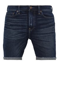 Tmavě modré džínové šortky s volným střihem, ohrnutými lemy, designem s pěti kapsami a předním zapínáním na knoflík. Jemné blednutí a detaily stehu.