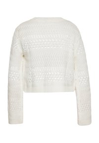 Maglione bianco a maniche lunghe con un motivo testurizzato che presenta forme a zigzag e occhielli. Realizzato in materiale lavorato a maglia, con orlo a costine.