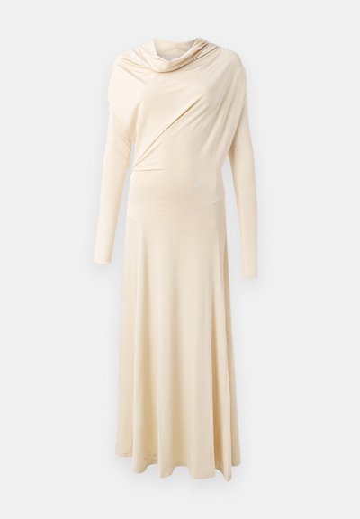 Long-sleeved, beige dress made from soft, draped fabric. Features a cowl neck and a flowing silhouette that extends to the floor.