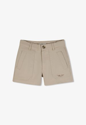 Shorts beiges pour femmes avec poches avant, passants pour ceinture, fermeture par bouton et petite décoration en cristal en forme d'aile sur la poche gauche.