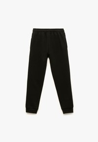 Zwarte katoenen joggerpants met een elastische tailleband, taps toelopende pijpen en ribbelmanchetten. Voorzien van zijzakken en een zachte textuur.
