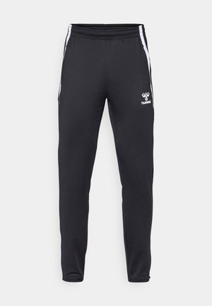 Black athletic pants made of smooth fabric, featuring white side stripes and a small logo on the left thigh. Elastic waistband for fit.