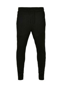 Pantalons de jogging noirs en tissu doux, avec une taille à cordon de serrage, une coupe ajustée et des accents de panneaux au niveau des genoux pour plus de détail.