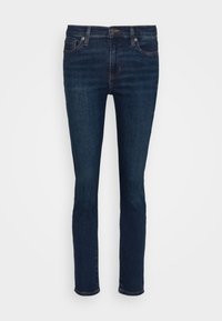 Mörkblå denimjeans med slim fit, femficksdesign och synliga sömnadsdetaljer. Har stängning med knapp och dragkedja.