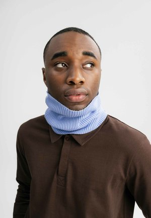 Light blue ribbed knit neck warmer worn over a dark brown long-sleeve polo shirt, featuring a folded design for added warmth.