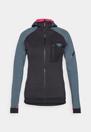 Svart og grå jakke med glidelås, hette og figursydd design. Har en frontlomme på brystet og rosa detaljer på kragen og mansjettene.