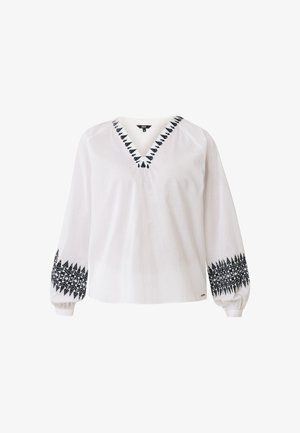 Blusa blanca de manga larga con escote en V, que presenta patrones de hojas bordados en negro a lo largo del escote y los puños. Hecha de una tela ligera.