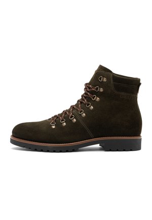 Dark brown suede hiking boot with metal eyelets, brown laces, padded ankle collar, and black lugged sole on white background.