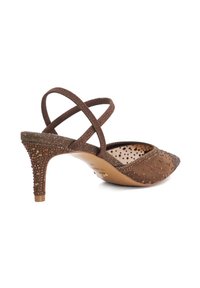 Brown high-heeled shoe with a pointed toe, textured suede, crisscross straps, and beaded accents on the heel and upper.