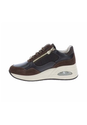 Sneaker marrone e nera con suola bianca spessa, cerniera laterale e lacci, che mostra un cuscinetto d’aria nell’area del tallone.