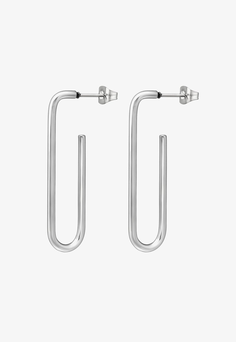 Boucles d'oreilles en métal argenté au design moderne en forme de u allongée. Texture lisse avec une finition brillante et un fermoir sûr pour le port.