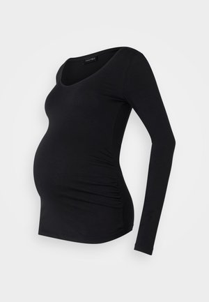 Black long-sleeve maternity top with a scoop neckline, featuring gathered detailing on the sides for a fitted look. Made from soft fabric.