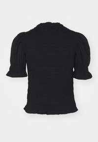 Blusa nera arricciata con maniche a palloncino corte e orlo a balze. Tessuto texturizzato con un design arricciato su tutta la parte del capo.